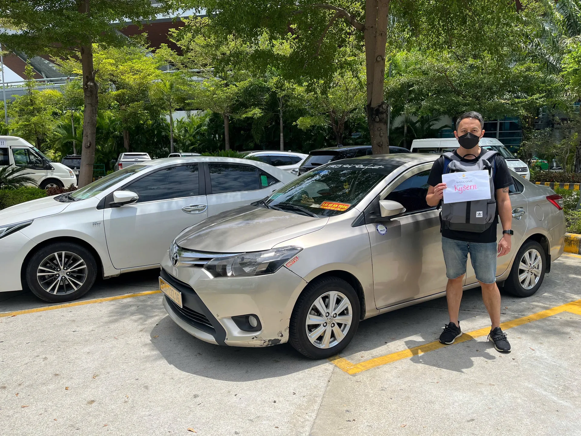 Mr. Dũng with his Toyota Vios at Da Nang Airport