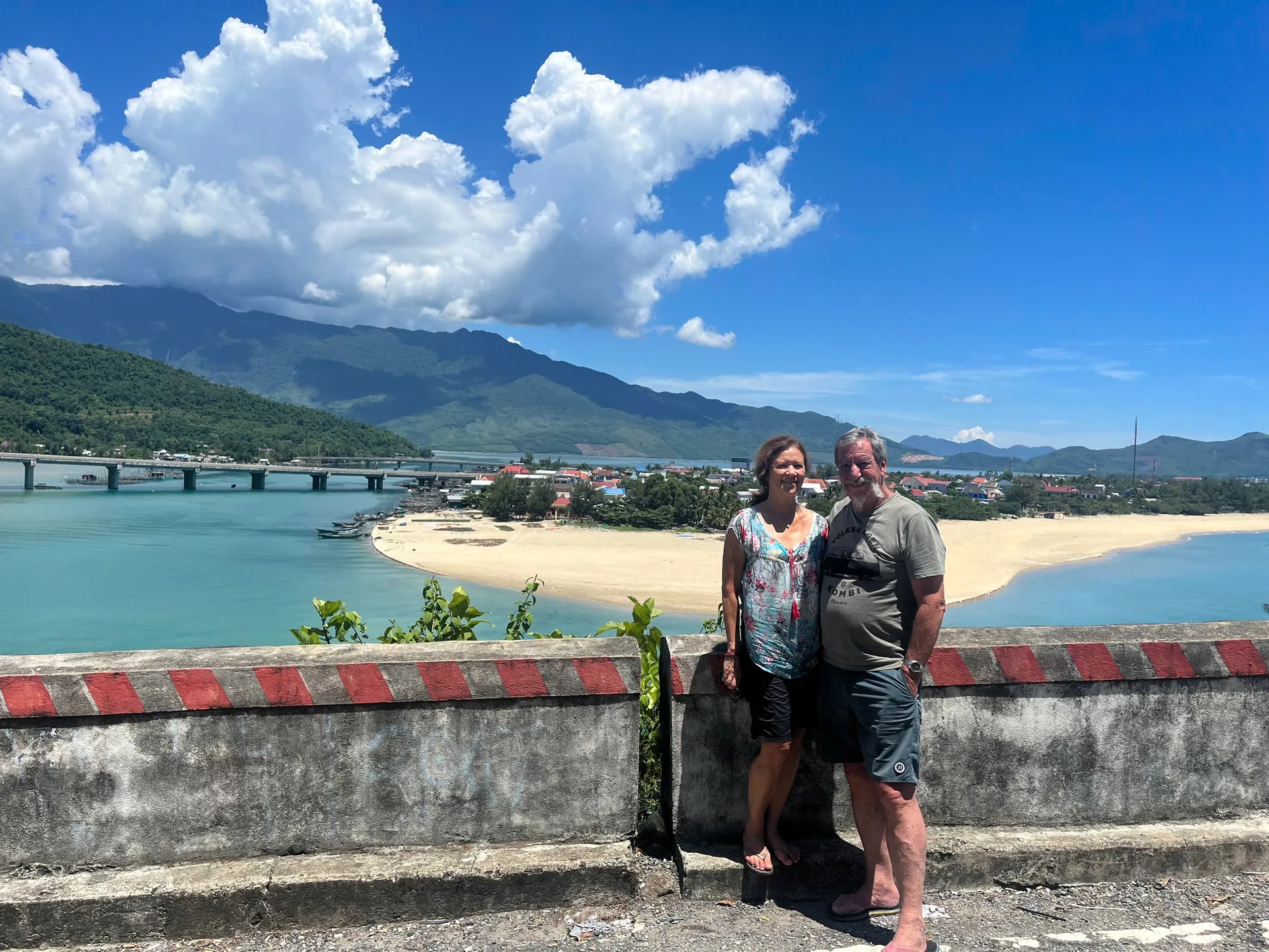 Couple at Hai Van Pass with stunning coastal views
