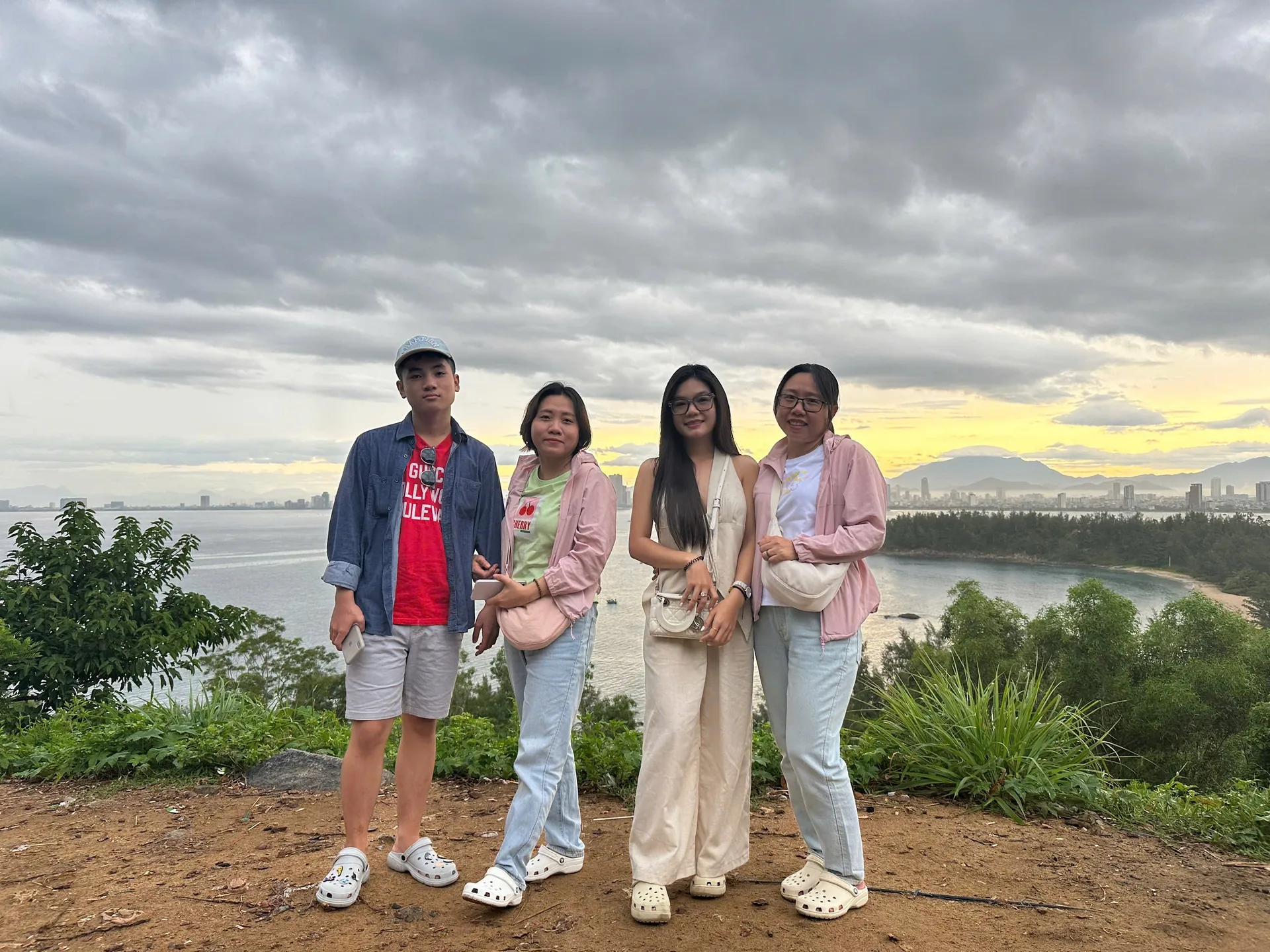 Group photo at Son Tra peninsula with Da Nang city at sunset